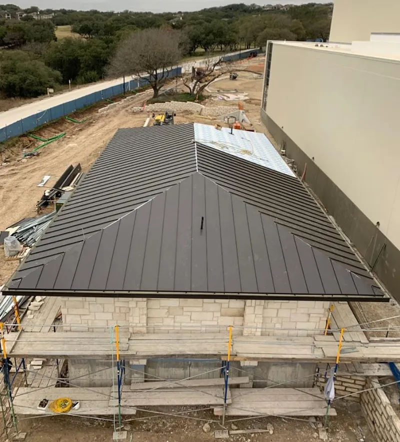 Metal roof new construction with scaffolding in Madison